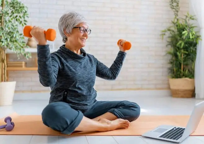 Older couple with yoga mats and water bottles after exercise